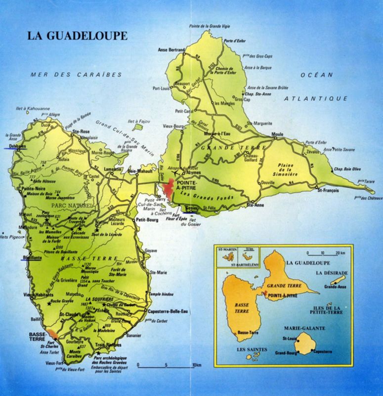 Physical map of Guadeloupe showing topography, roads, cities, and surrounding islands.